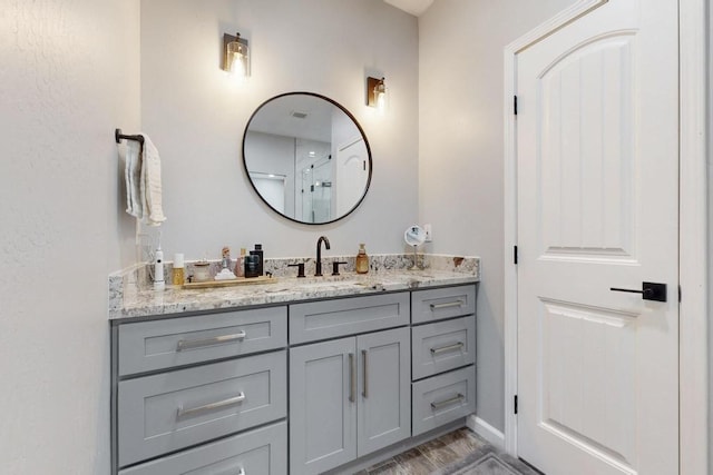 bathroom featuring vanity and baseboards