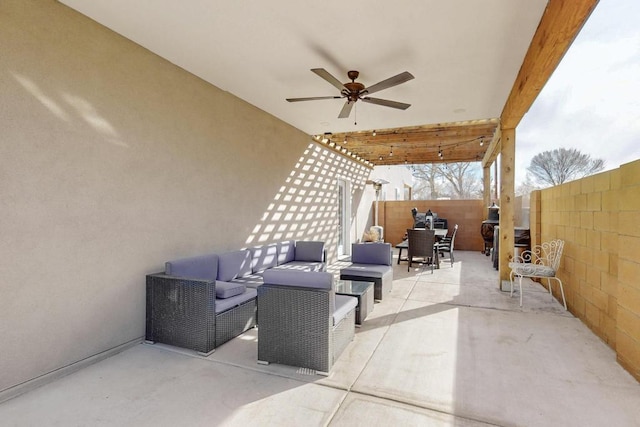 view of patio / terrace featuring outdoor lounge area, fence, and a ceiling fan