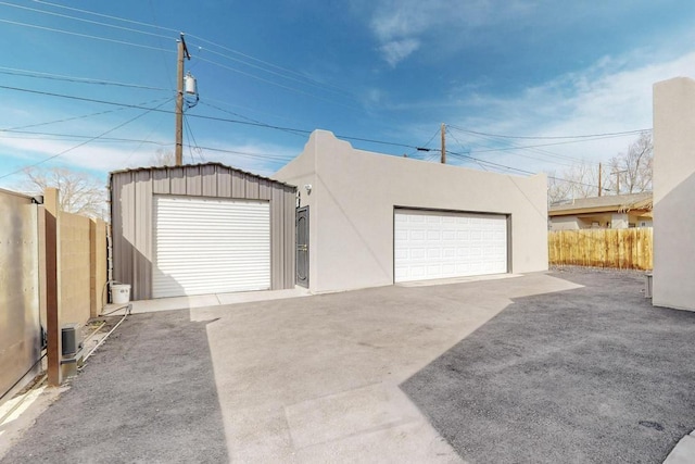 garage featuring fence