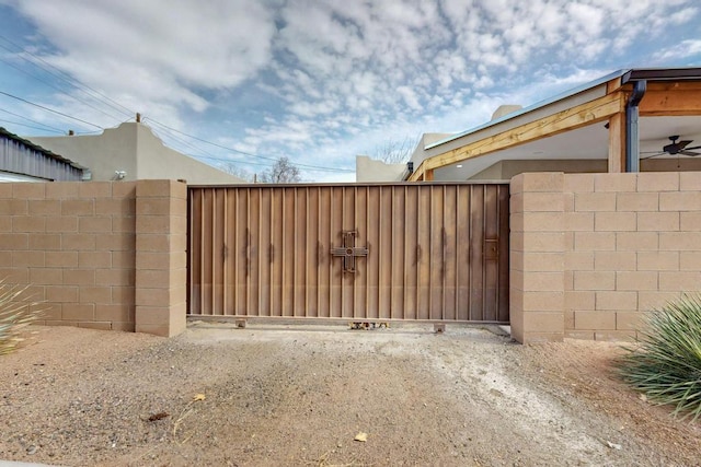 view of gate featuring fence