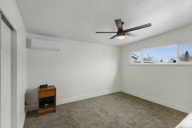 spare room featuring a ceiling fan, baseboards, carpet flooring, and a wall mounted air conditioner