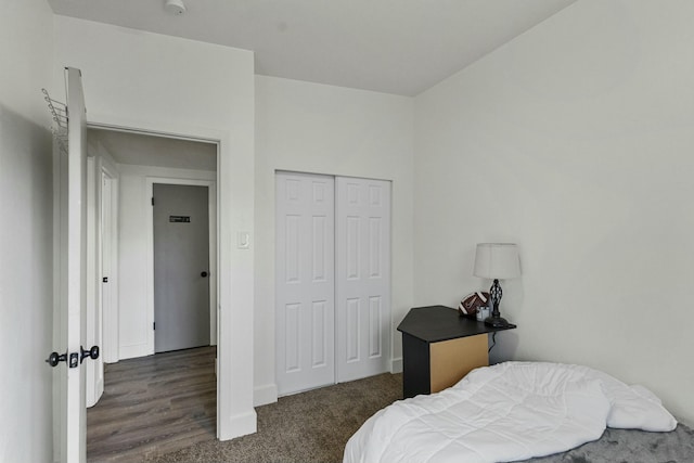 bedroom with a closet and baseboards