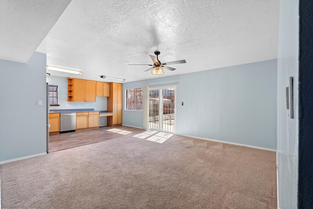 unfurnished living room with light carpet, baseboards, and a ceiling fan