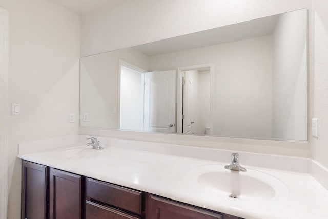 bathroom featuring double vanity and a sink