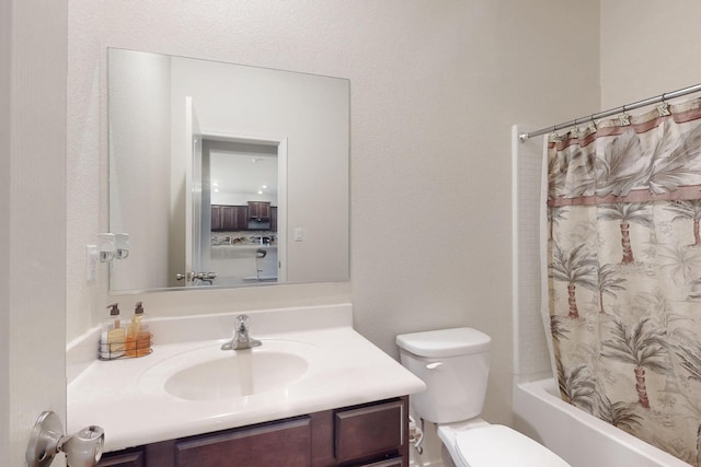 bathroom with toilet, shower / bath combination with curtain, and vanity