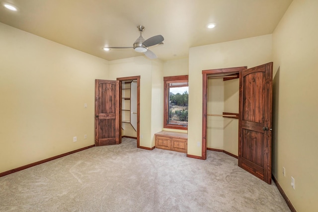 unfurnished bedroom with light carpet, recessed lighting, and baseboards