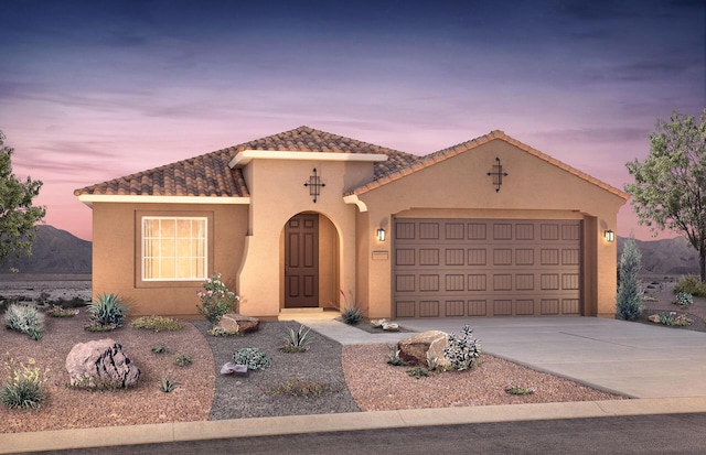 938 Lazuli Rd SE, Rio Rancho, NM 87124 - mediterranean / spanish house featuring stucco siding, concrete driveway, a tile roof, and an attached garage