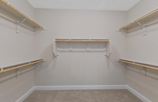 938 Lazuli Rd SE, Rio Rancho, NM 87124 - spacious closet featuring carpet flooring
