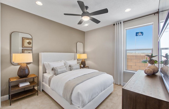 938 Lazuli Rd SE, Rio Rancho, NM 87124 - bedroom featuring baseboards, recessed lighting, ceiling fan, a textured ceiling, and light carpet