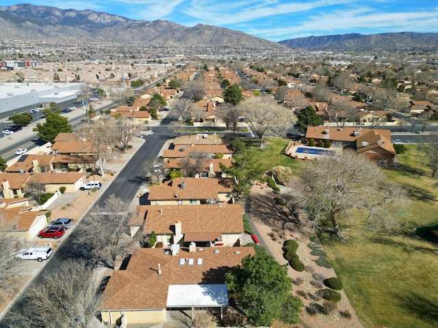 birds eye view of property with a mountain view and a residential view