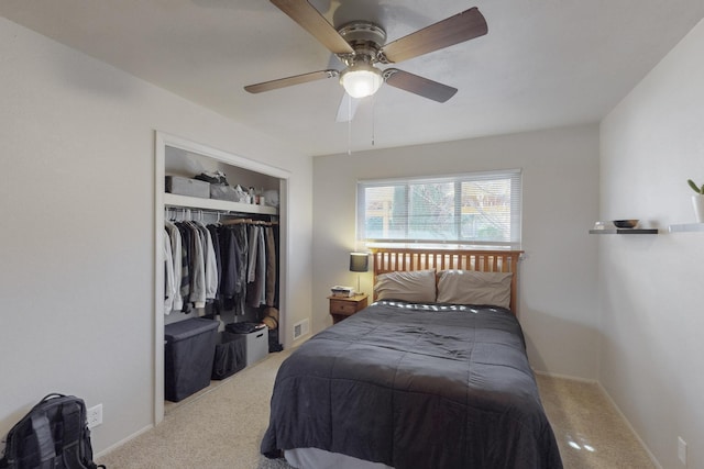 carpeted bedroom featuring a ceiling fan, a closet, visible vents, and baseboards