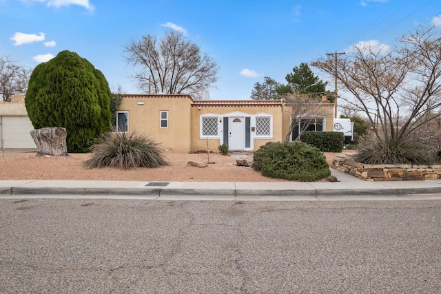 mediterranean / spanish house with stucco siding