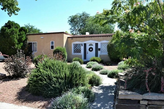 mediterranean / spanish home with stucco siding