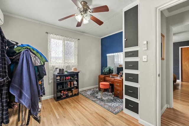 home office featuring ornamental molding, wood finished floors, a ceiling fan, and baseboards