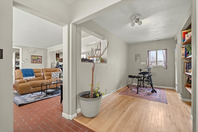 office space with wood finished floors and baseboards