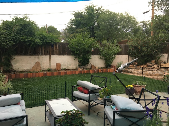 view of patio / terrace featuring a fenced backyard and an outdoor hangout area