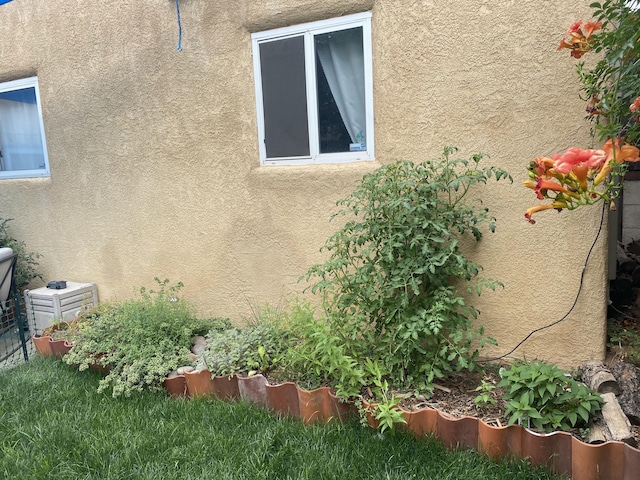 view of side of home featuring stucco siding