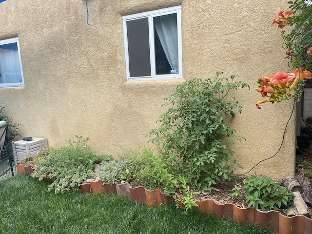 view of home's exterior with stucco siding