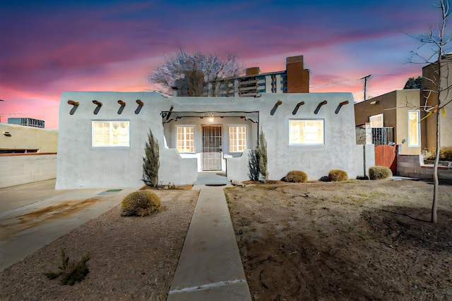 view of front of property featuring stucco siding