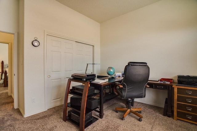 carpeted office space with baseboards