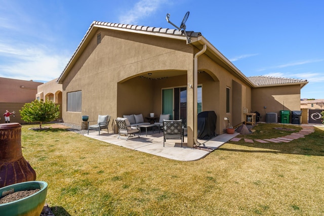 rear view of house with a tiled roof, stucco siding, cooling unit, a yard, and a patio area