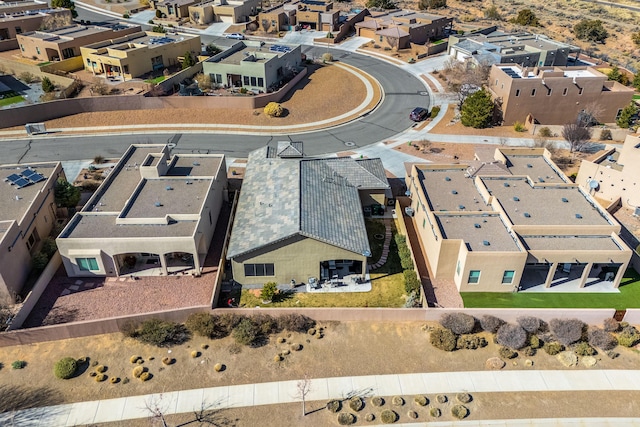 birds eye view of property with a residential view