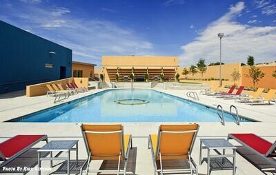 community pool with a patio area