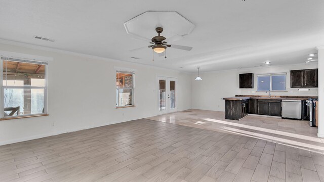 20 2nd St NE, Rio Rancho, NM 87124 - unfurnished living room featuring a sink, light wood-type flooring, plenty of natural light, visible vents, and ceiling fan