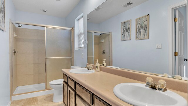 20 2nd St NE, Rio Rancho, NM 87124 - full bath featuring toilet, a sink, a shower stall, and visible vents