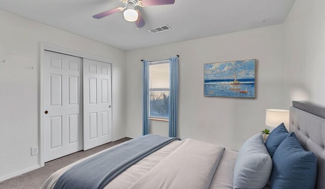 20 2nd St NE, Rio Rancho, NM 87124 - carpeted bedroom with a closet, baseboards, visible vents, and a ceiling fan