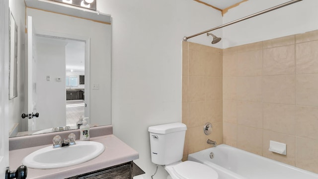 bathroom with toilet, shower / bath combination, and vanity