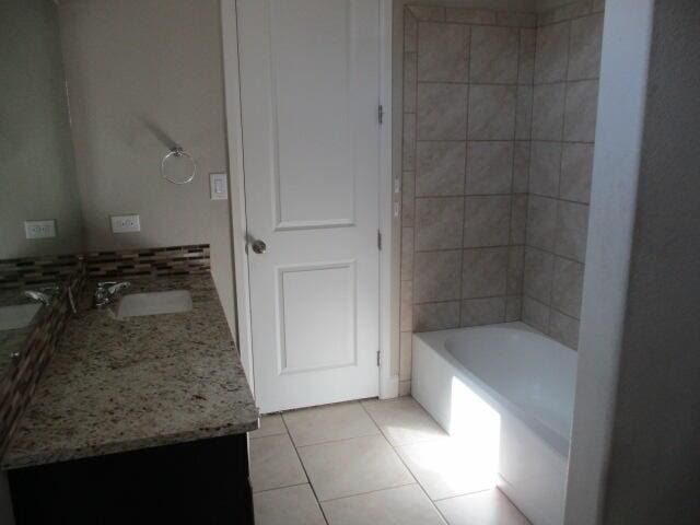 bathroom featuring backsplash, vanity, and tile patterned floors