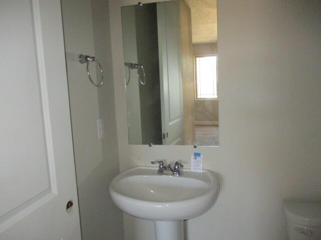 bathroom featuring a sink and toilet