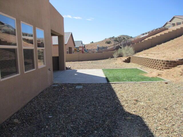 view of yard with a patio and a fenced backyard