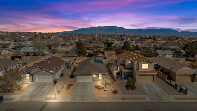 drone / aerial view with a residential view and a mountain view