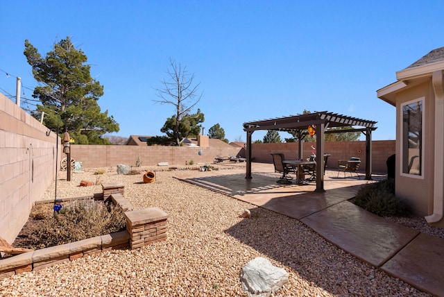 view of yard featuring a fenced backyard, a patio, and a pergola