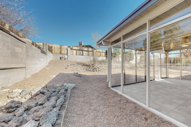 view of yard featuring a patio and a fenced backyard