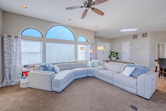 carpeted living room with recessed lighting, visible vents, ceiling fan, and baseboards