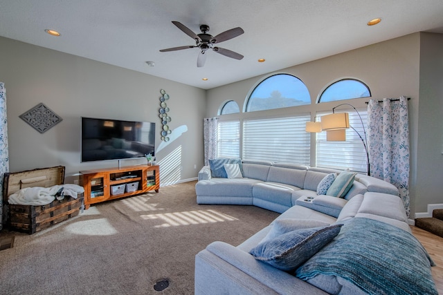 living room featuring recessed lighting, ceiling fan, and baseboards