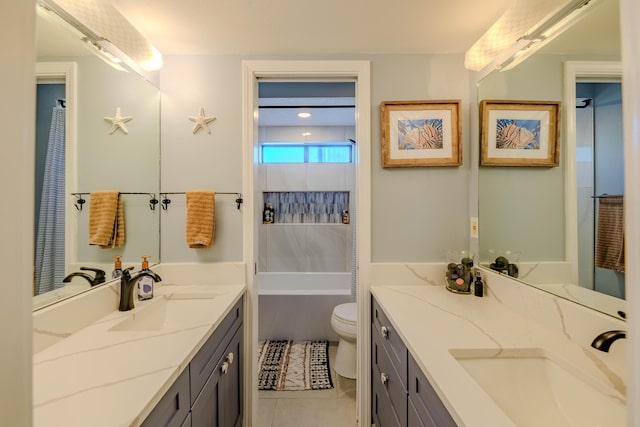 bathroom featuring toilet, a tub, tile patterned floors, and vanity