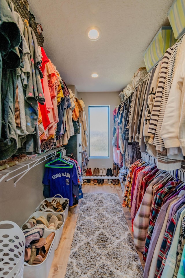 spacious closet featuring wood finished floors