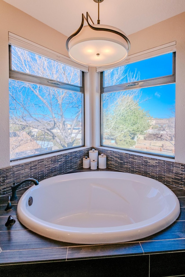 bathroom with a garden tub