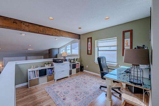 office with recessed lighting, lofted ceiling with beams, a textured ceiling, light wood-type flooring, and baseboards