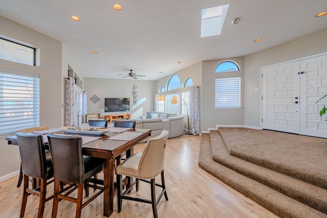 dining room featuring light wood-type flooring, baseboards, and recessed lighting