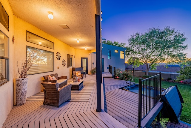 deck at dusk featuring outdoor lounge area