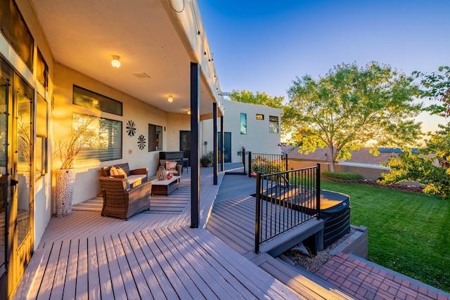 deck with an outdoor hangout area and a lawn