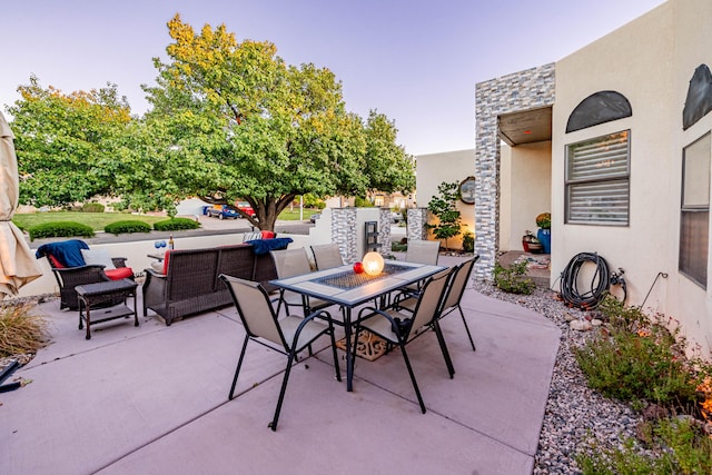 view of patio with an outdoor hangout area and outdoor dining area