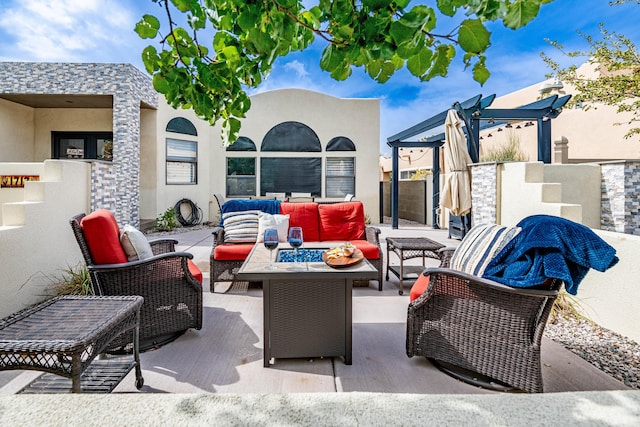 view of patio with an outdoor living space and a pergola