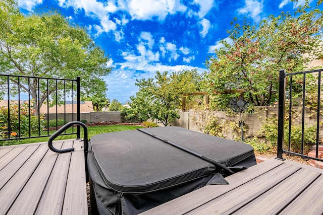 deck with a fenced backyard