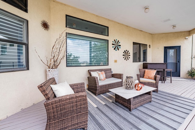 wooden deck featuring an outdoor hangout area